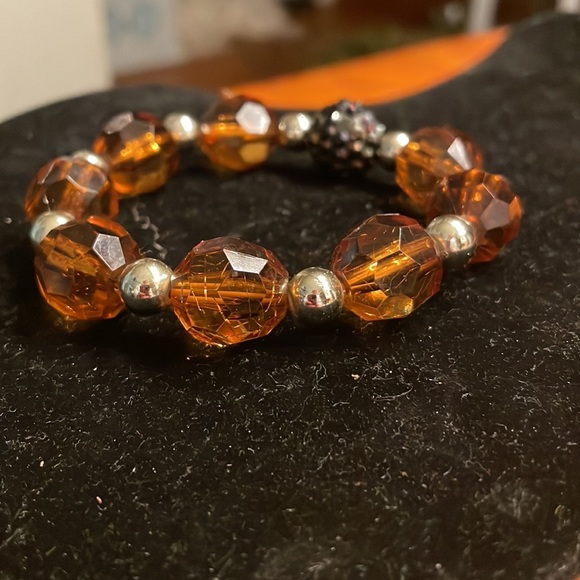 8” stackable stretch bracelet with 8 amber color & 9 silver tone beads - Picture 3 of 13